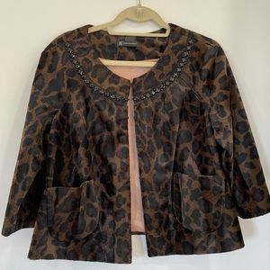 Leopard print cape style jacket with bejeweled neckline. Size Medium